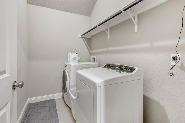 washroom with light tile patterned floors and independent washer and dryer