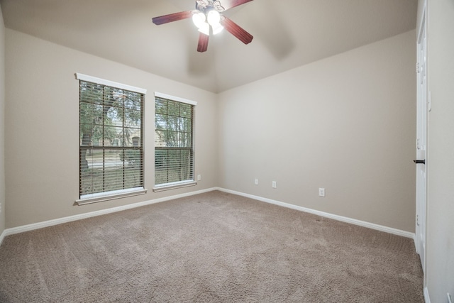 empty room with ceiling fan and carpet floors