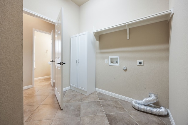 clothes washing area featuring hookup for a washing machine, hookup for a gas dryer, hookup for an electric dryer, and light tile patterned floors