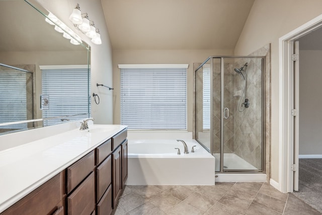 bathroom with lofted ceiling, vanity, independent shower and bath, and tile patterned floors