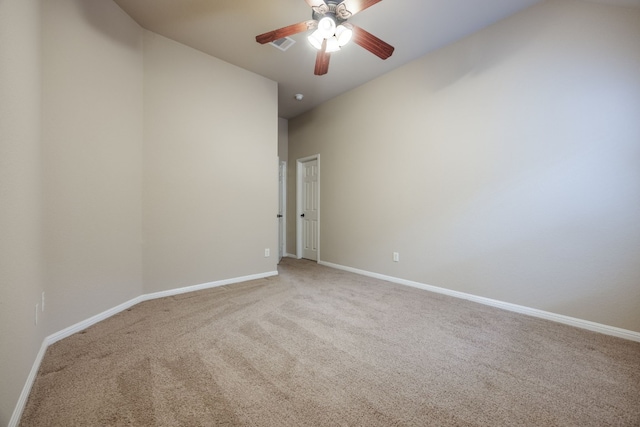 unfurnished room with ceiling fan and carpet flooring