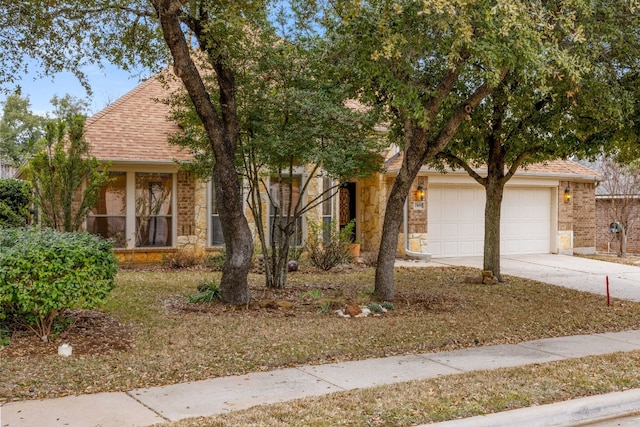 obstructed view of property with a garage