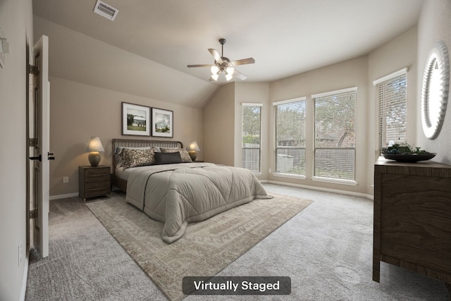 carpeted bedroom featuring lofted ceiling and ceiling fan