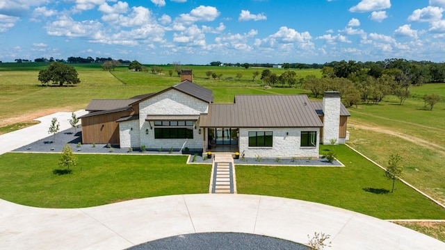 1318 Country Side Bnd, Fredericksburg, TX 78624 - view of front of property featuring stone siding, a chimney, a rural view, and a front lawn