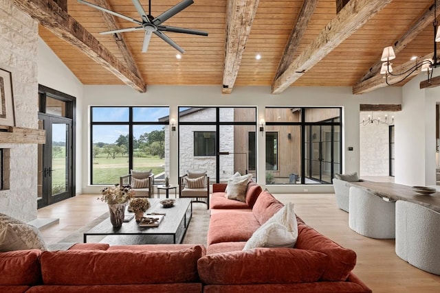 living room featuring high vaulted ceiling, a high end fireplace, wood ceiling, beam ceiling, and light hardwood / wood-style flooring