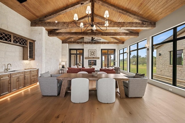 1318 Country Side Bnd, Fredericksburg, TX 78624 - dining area featuring wooden ceiling with exposed beams, wood finished floors, a chandelier, and high vaulted ceiling