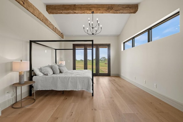 bedroom featuring vaulted ceiling with beams, a notable chandelier, access to exterior, and light wood-type flooring