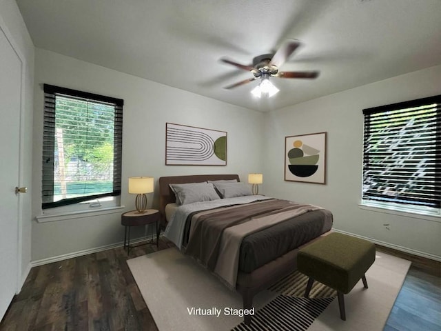 bedroom with dark wood-type flooring and ceiling fan