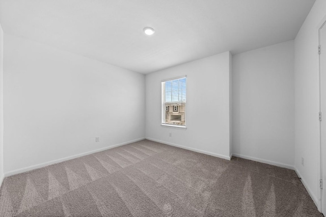 unfurnished room with carpet floors