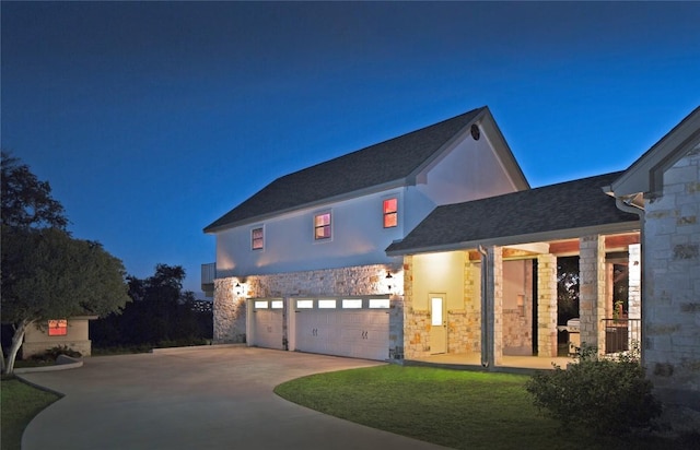 view of front of house with a garage and a front yard