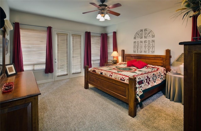 carpeted bedroom featuring access to outside and ceiling fan