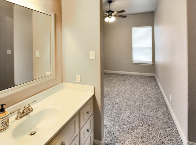 bathroom with ceiling fan and vanity