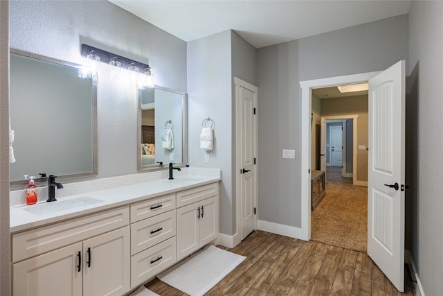 bathroom featuring vanity and hardwood / wood-style flooring