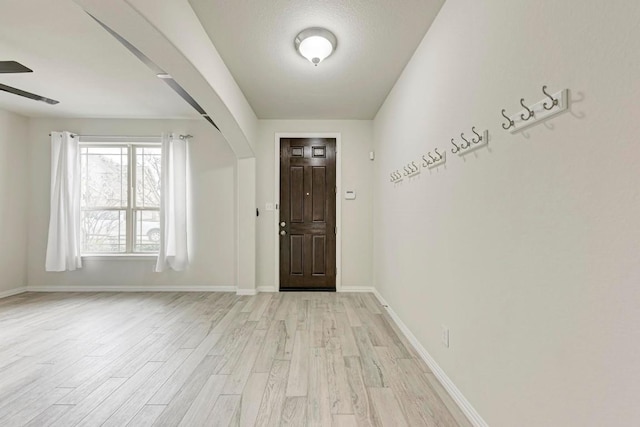 foyer featuring light hardwood / wood-style flooring and ceiling fan