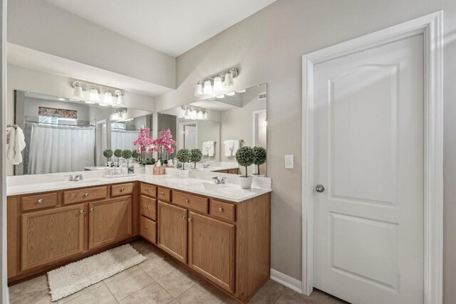 bathroom with tile patterned flooring and vanity