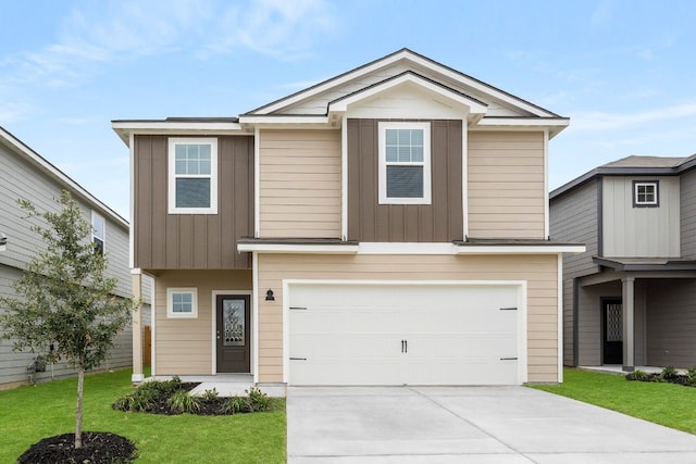 view of front facade with a garage and a front lawn