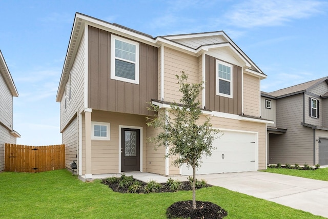 view of front of property featuring a garage and a front lawn