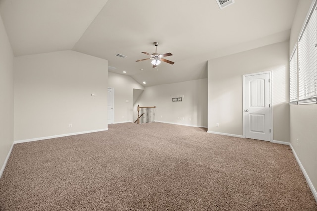 unfurnished living room featuring ceiling fan, carpet floors, and vaulted ceiling