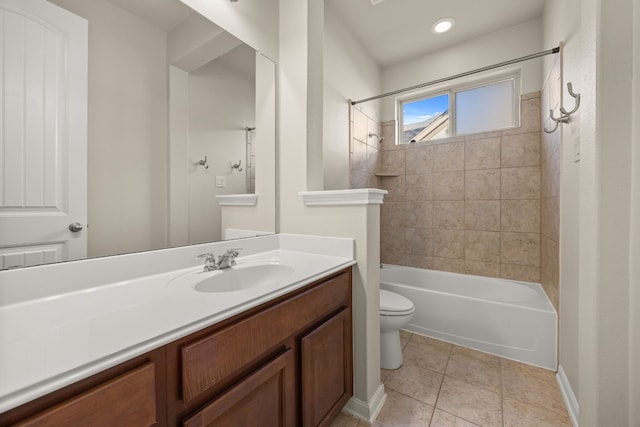 full bathroom featuring tiled shower / bath combo, vanity, tile patterned floors, and toilet