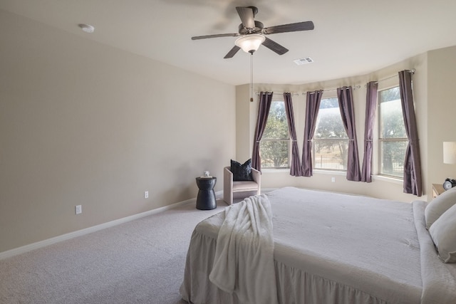 bedroom with ceiling fan and carpet flooring