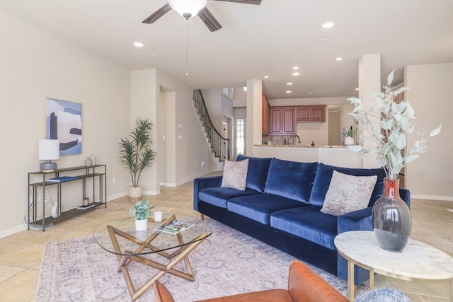 tiled living room with ceiling fan