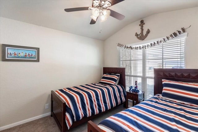 carpeted bedroom featuring lofted ceiling and ceiling fan