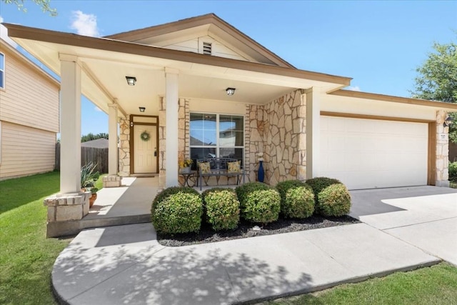 view of front of property with a garage and covered porch