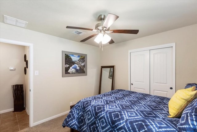 tiled bedroom featuring a closet and ceiling fan