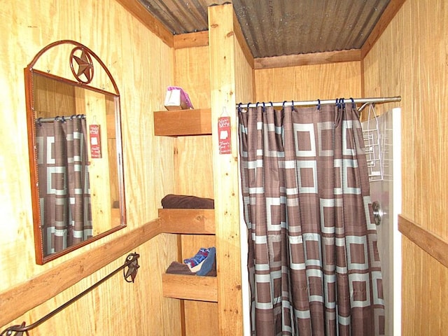 1361 Ropers Alley Rd, Belton, TX 76513 - bathroom view of a shower with curtain, wood ceiling, and wooden walls