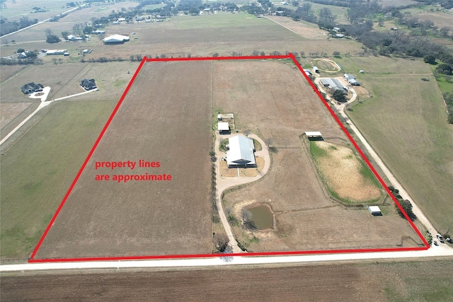 birds eye view of property featuring a rural view