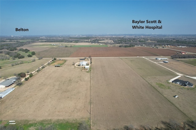 birds eye view of property featuring a rural view