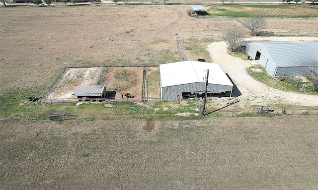 birds eye view of property featuring a rural view