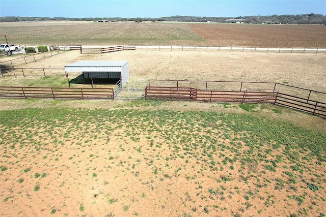 view of yard with a rural view