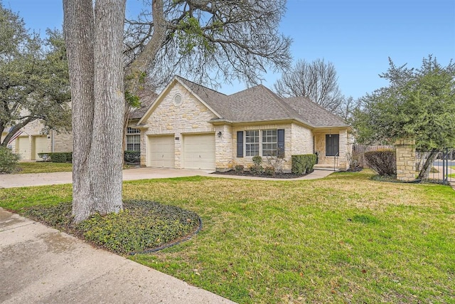 view of front facade featuring concrete driveway, fence, a garage, stone siding, and a front lawn