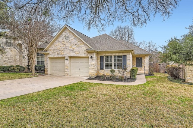 view of front of house with concrete driveway, an attached garage, fence, stone siding, and a front lawn