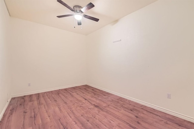 spare room with light wood-style flooring, baseboards, and ceiling fan