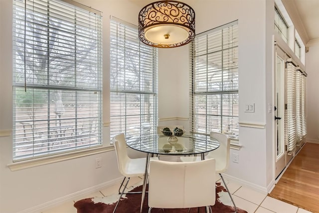 tiled dining space with baseboards