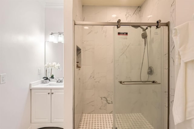 full bath with a marble finish shower and vanity