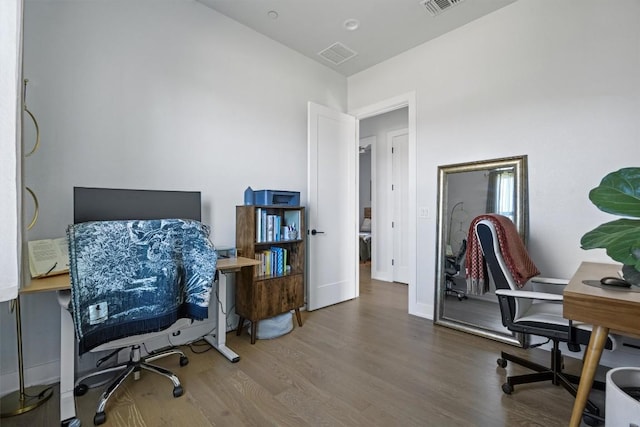 office space with hardwood / wood-style floors