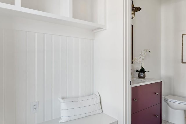 bathroom featuring vanity and toilet