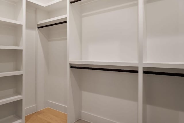 spacious closet featuring light wood-type flooring