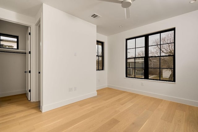 spare room featuring ceiling fan and light hardwood / wood-style floors