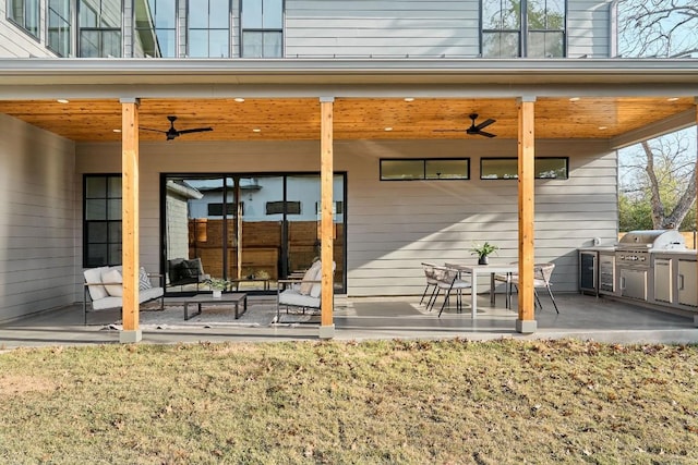 back of property featuring a patio area and ceiling fan