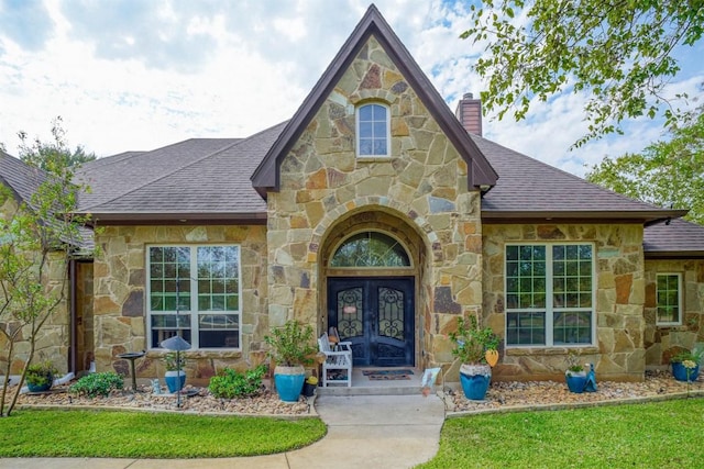 property entrance featuring french doors