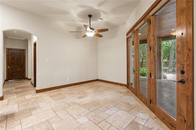 spare room with ceiling fan