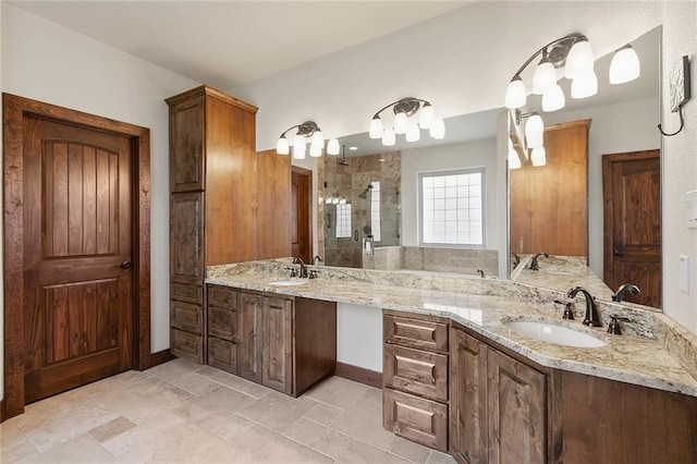 bathroom featuring vanity and tiled shower