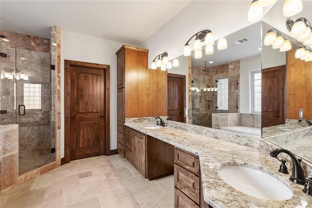 bathroom featuring vanity and a shower with door