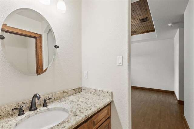 bathroom with vanity and hardwood / wood-style floors