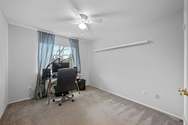 carpeted office featuring ceiling fan