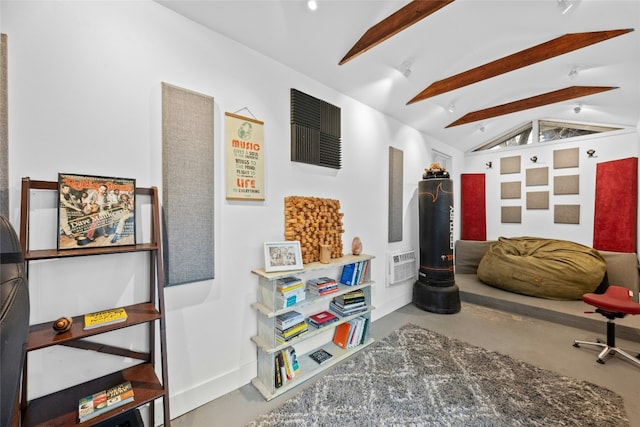 interior space with lofted ceiling with beams and concrete floors